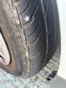 Car tyre with puncture - puncture repair Essex
